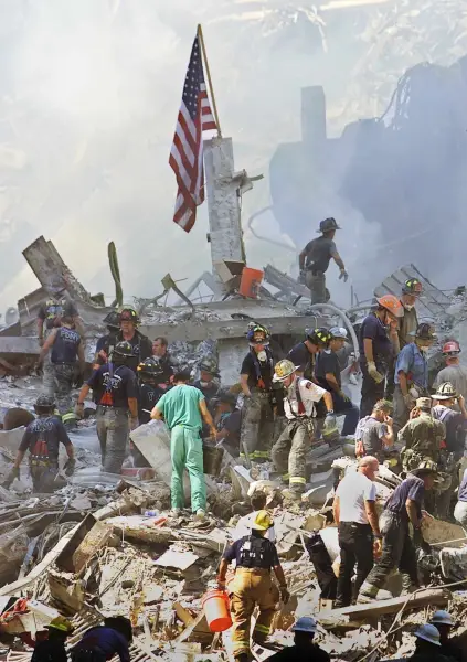 American flag in rubble