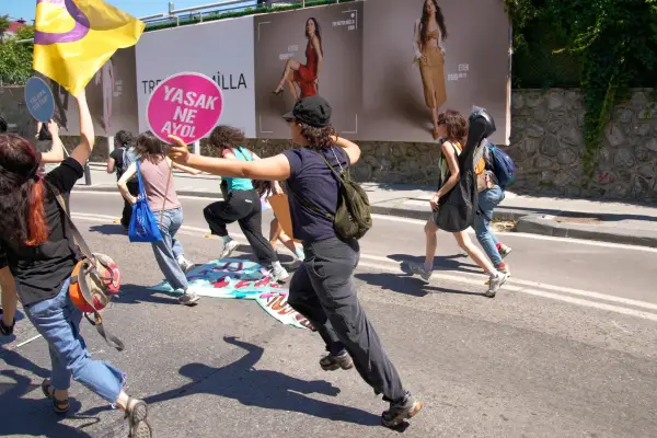 FILE - People run from the police during a march in support of transgender people and their rights during the LGBTQ Pride week, in Istanbul, Turkey, on June 21, 2026. (AP Photo/Dilara Acikgoz, File)