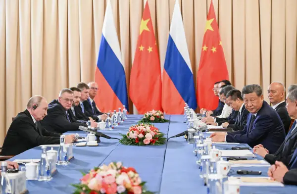 In this pool photograph distributed by the Russian state agency Sputnik, Russia's President Vladimir Putin and China's President Xi Jinping hold a meeting on the sidelines of the Shanghai Cooperation Organisation (SCO) summit in Bishkek on August 31, 2026. (Photo by Kristina Solovyova / POOL / AFP via Getty Images)