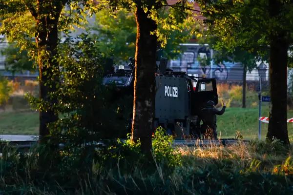 epa13199569 epa13199568 Armed police officers with an armored special-purpose vehicle block a street near the Schachen horse racing track following a shooting during a rave event at the Schachen horse racing track near Aarau, Switzerland, 30 August 2026. A shooting occurred during an event at the Schachen in Aarau late in the evening of 29 August. Several people were injured, according to a statement by the Aargau Cantonal Police on the platform X. EPA/MICHAEL BUHOLZER EPA/MICHAEL BUHOLZER