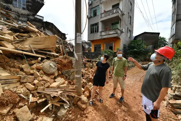 Staff members check the damaged power equipment in Huating Town of Putian City, southeast China's Fujian Province, Sept. 5, 2026.